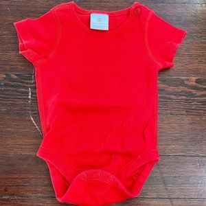 Like new, adjustable red onesie